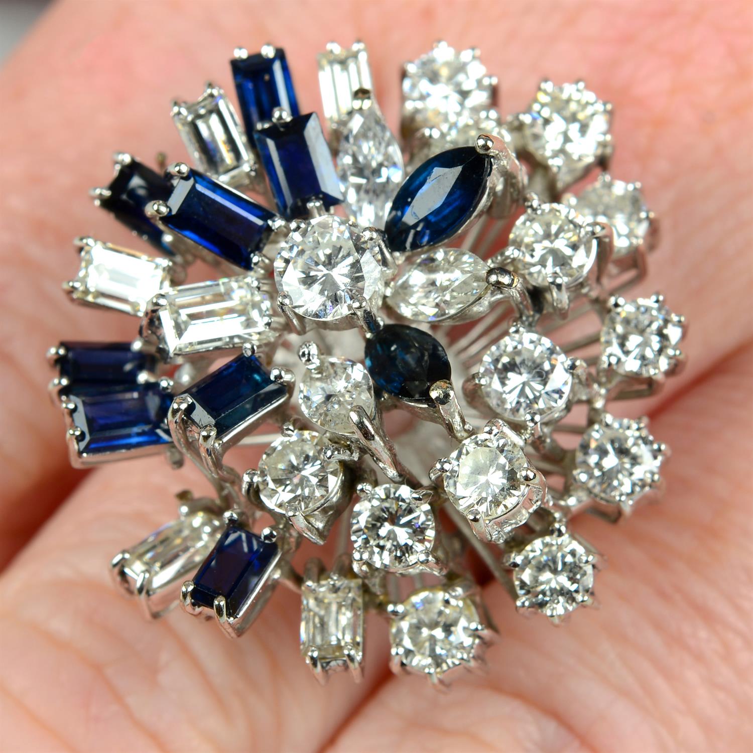 A mid 20th century 18ct gold vari-cut diamond and sapphire cocktail ring.