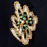 A mid 20th century bi-colour 18ct gold, diamond and emerald abstract brooch.
