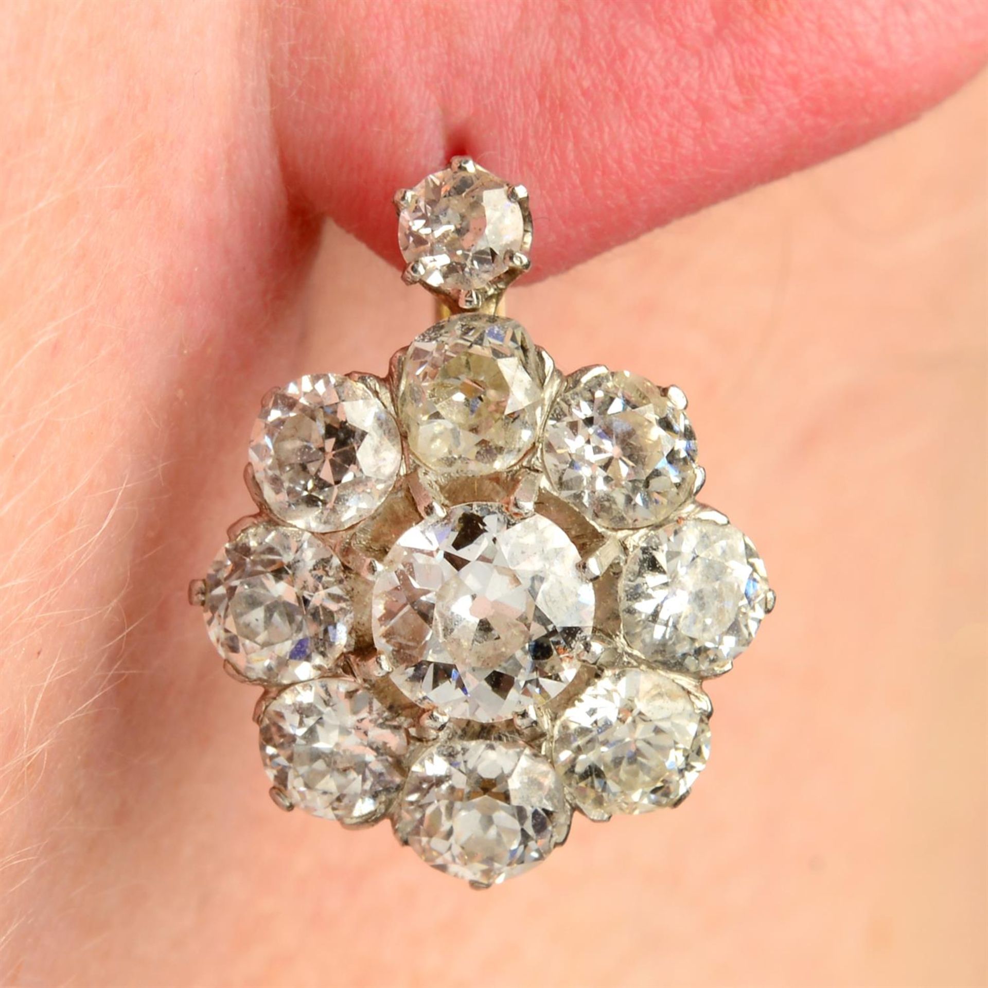 A pair of late 19th century 18ct gold old-cut diamond cluster earrings.