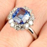 A Madagascan sapphire ring, with brilliant and baguette-cut diamond surround.
