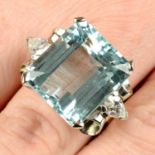 An aquamarine and pear-shape diamond three-stone dress ring.