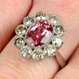 A pink topaz and brilliant-cut diamond cluster ring.