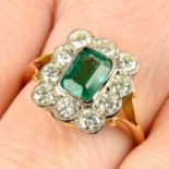 An emerald and brilliant-cut diamond cluster ring.