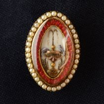 A late Georgian gold, red enamel and split pearl brooch, the central glazed hairwork panel