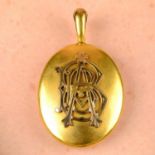 A late 19th century gold monogrammed locket.