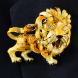 A mid 20th century 18ct gold enamel lion brooch, with single-cut diamond eyes.