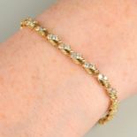 A brilliant-cut diamond line bracelet.