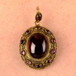 A 19th century gold foil-back garnet mourning pendant, with hair work reverse.