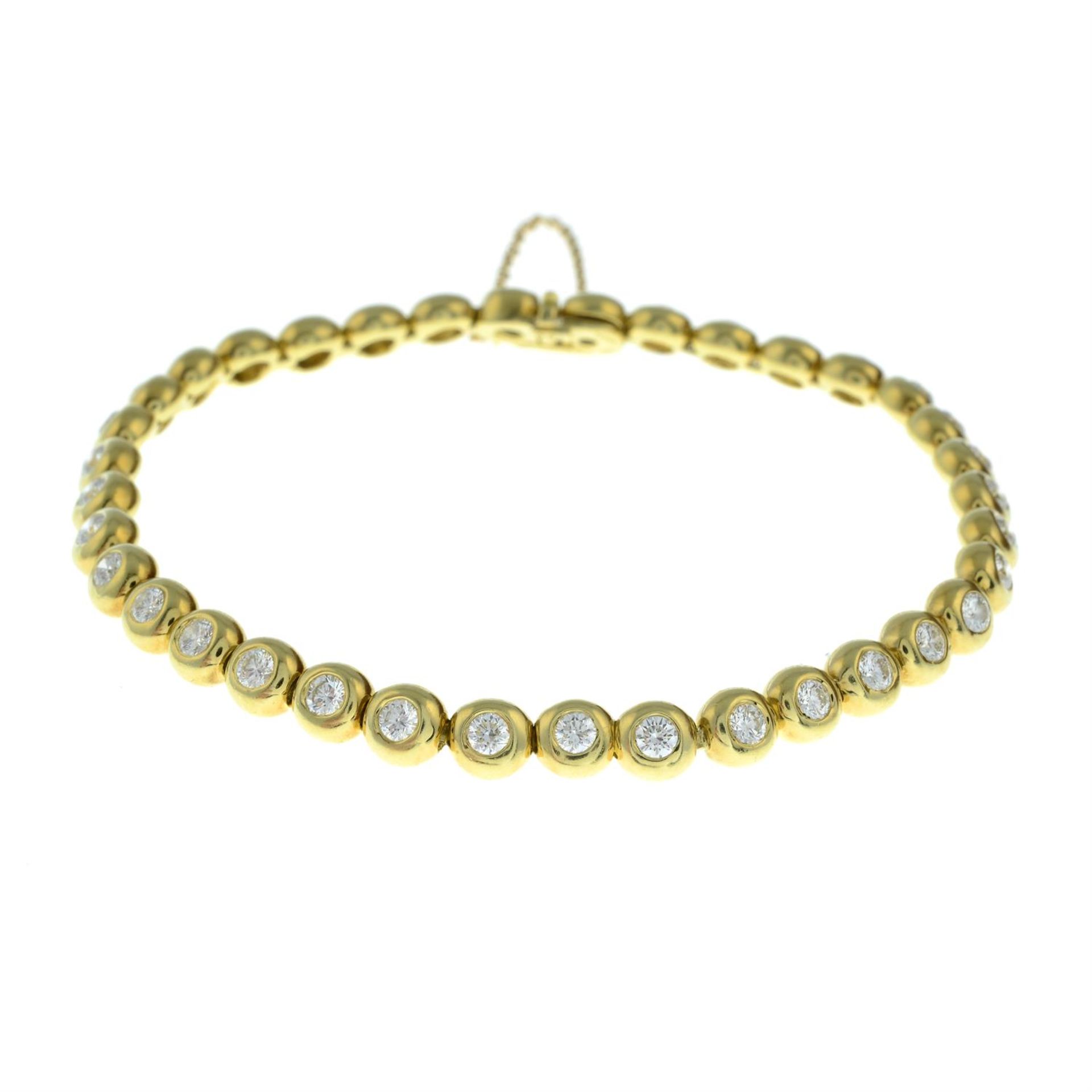 An 18ct gold brilliant-cut diamond collet bracelet, by Tiffany & Co. - Bild 2 aus 3