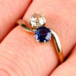 An early 20th century 18ct gold and platinum sapphire and old-cut diamond two-stone crossover ring.