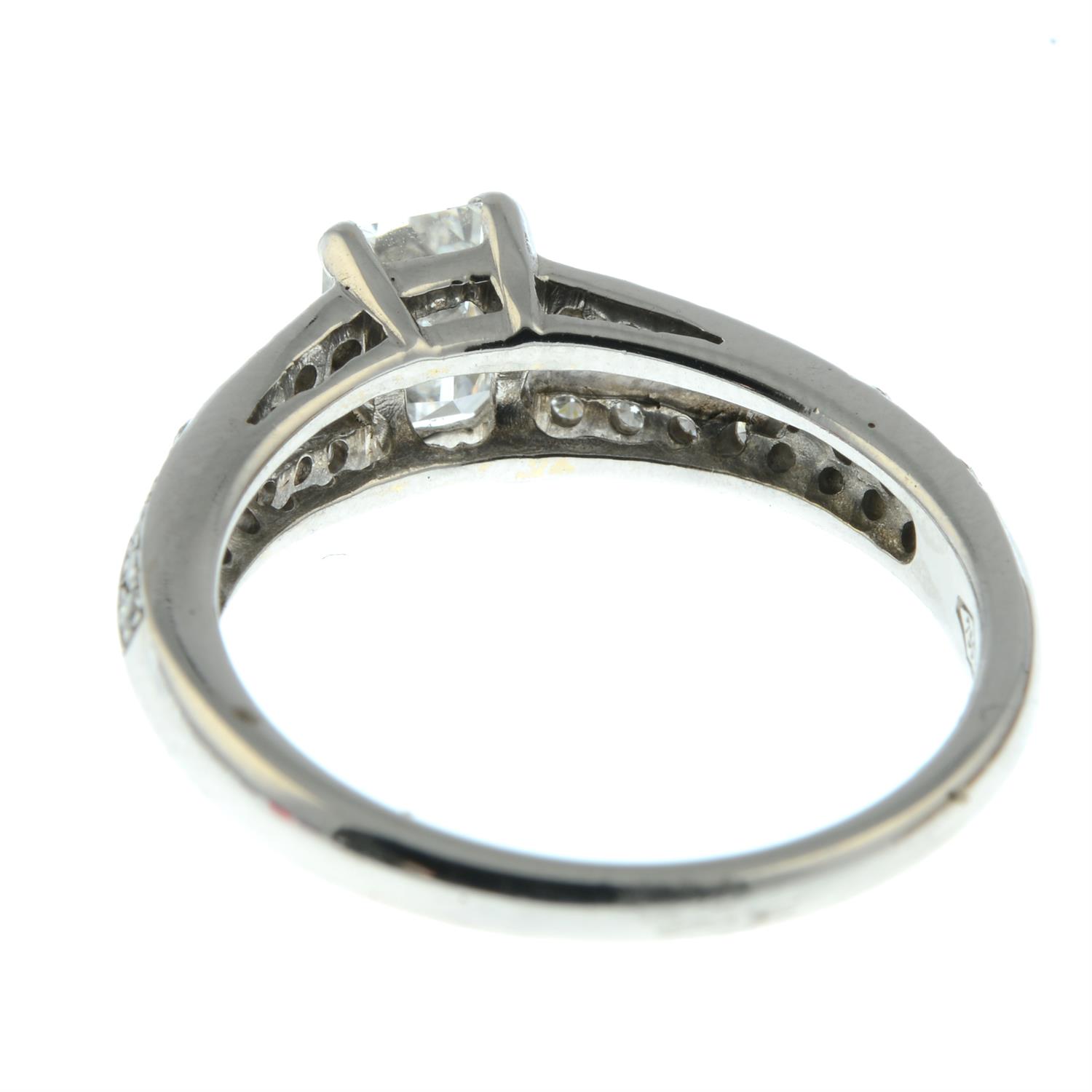 An emerald-cut diamond ring, with brilliant-cut diamond split shoulders. - Image 4 of 5