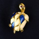 A novelty tortoise brooch, with blue and opalescent white enamel shell and ruby eyes.