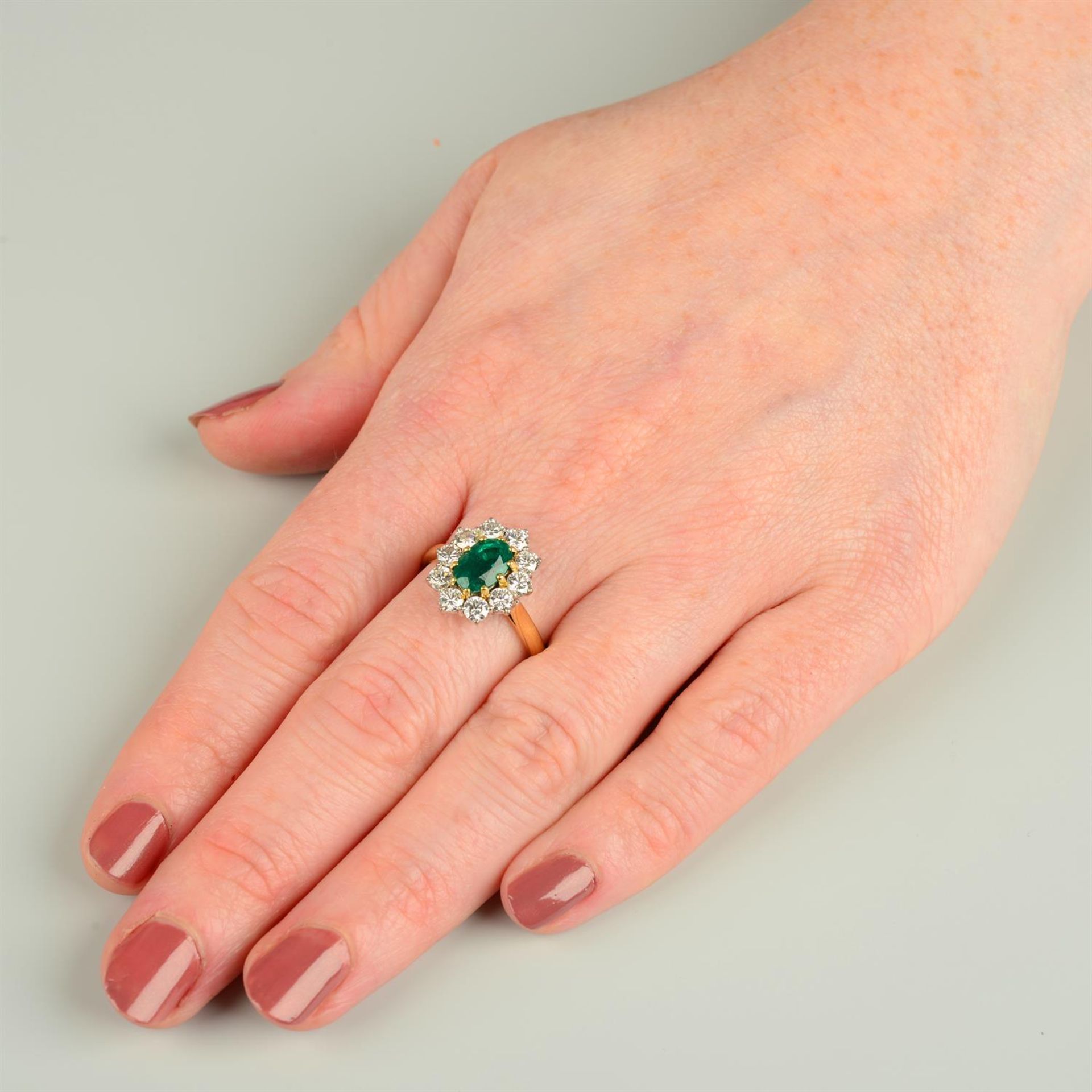 An 18ct gold emerald and brilliant-cut diamond cluster ring, by Cropp & Farr. - Image 5 of 5