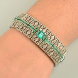 An emerald and diamond pierced lattice bracelet.