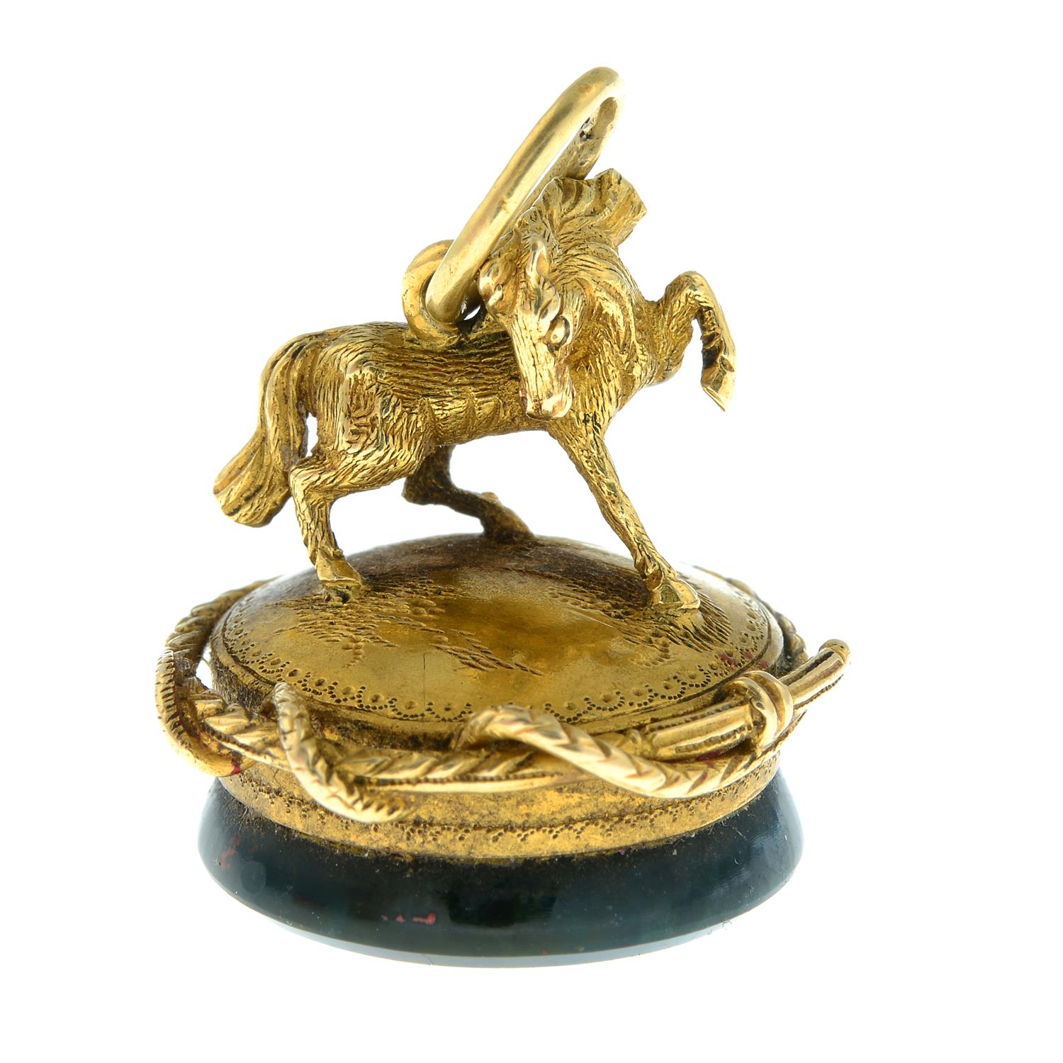 A Victorian gold bloodstone seal, with figural horse and encircling whip. - Image 2 of 4
