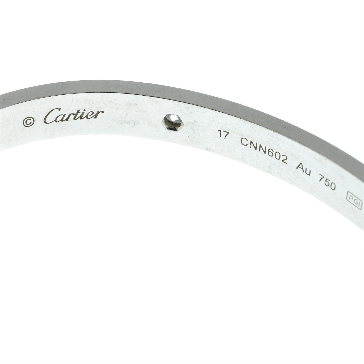 A brilliant-cut diamond 'Love' bangle, by Cartier. - Image 4 of 4