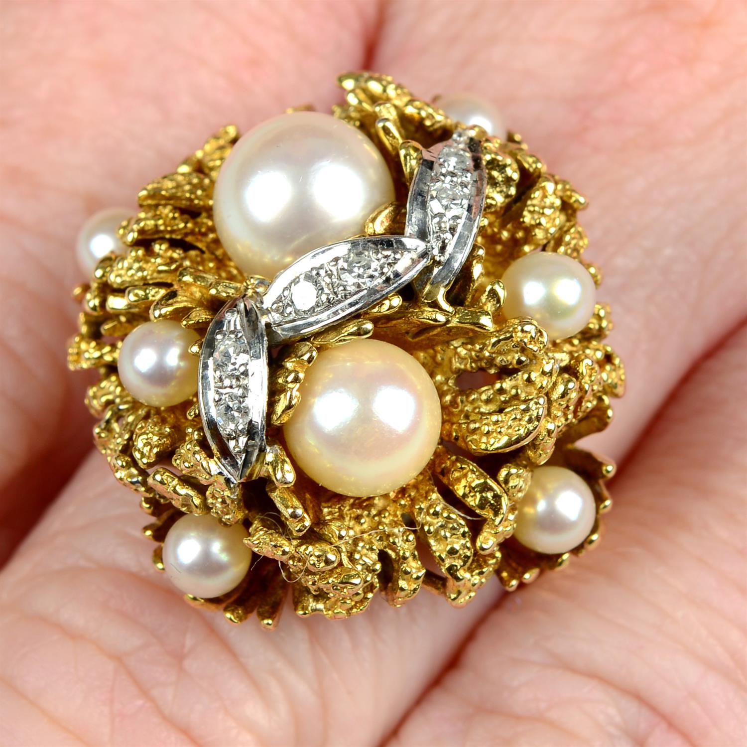 A mid 20th century 18ct gold cultured pearl and single-cut diamond floral bombé ring.