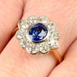 A sapphire and circular-cut diamond cluster ring.