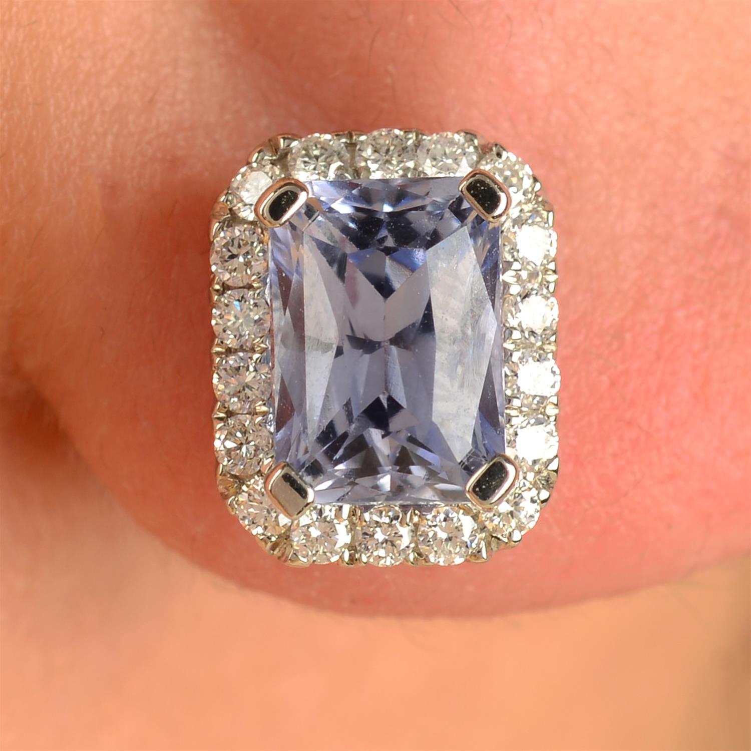 A pair of lilac sapphire and brilliant-cut diamond cluster earrings.