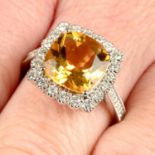 An 18ct gold citrine and brilliant-cut diamond cluster ring.