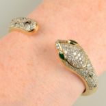 A pavé-set diamond hinged snake cuff bangle, with black gem pattern and emerald eyes.