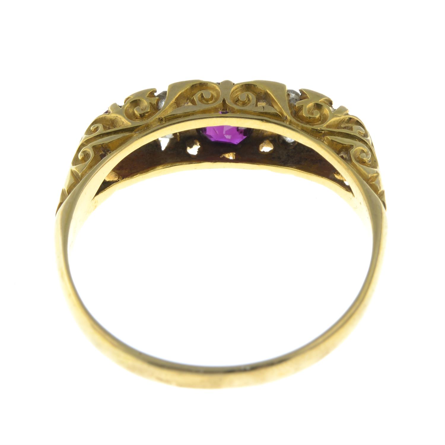 An early 20th century 18ct gold graduated ruby three-stone ring, with diamond spacers. - Image 4 of 5