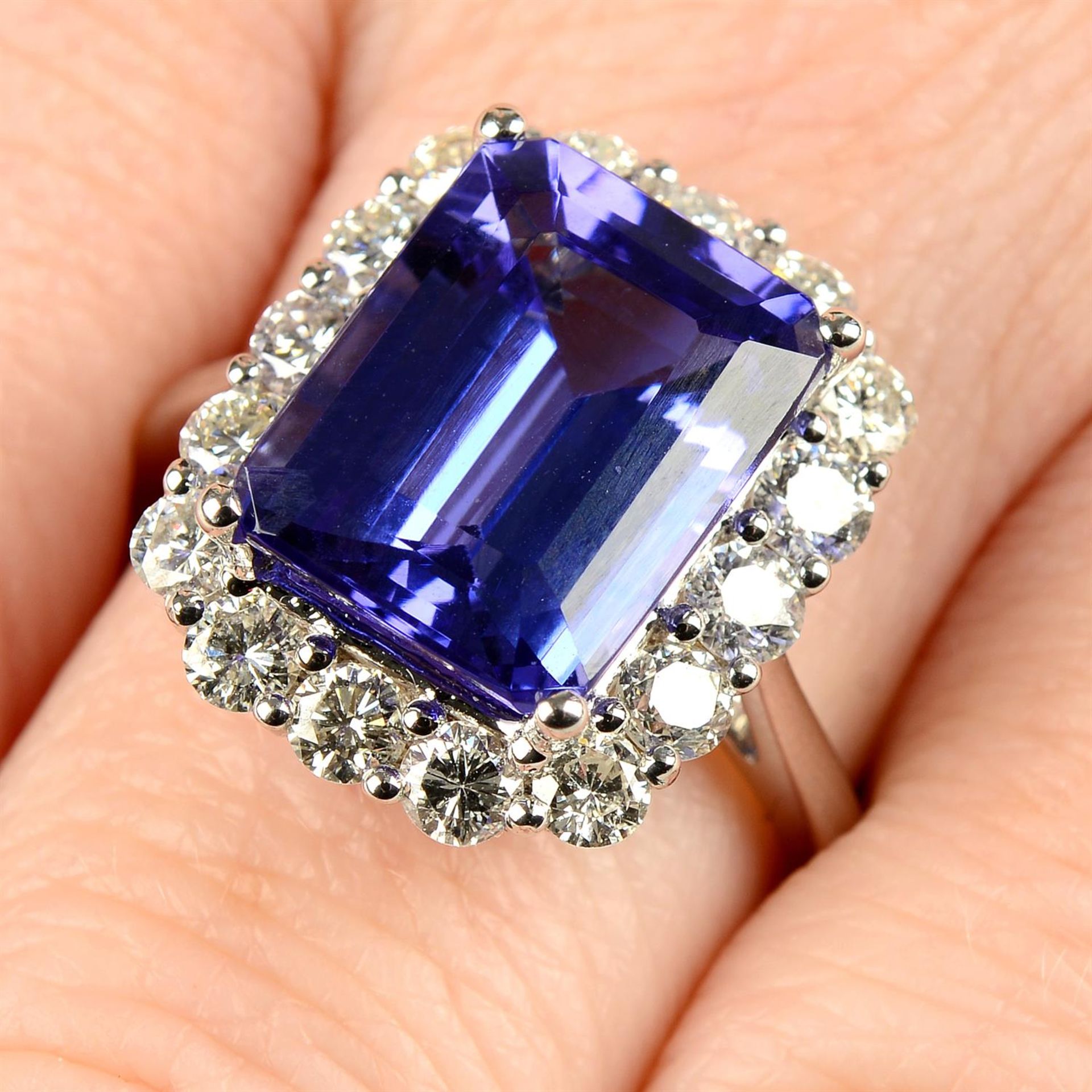 An 18ct gold tanzanite and brilliant-cut diamond cluster ring.