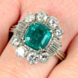 An emerald and vari-cut diamond cluster ring.