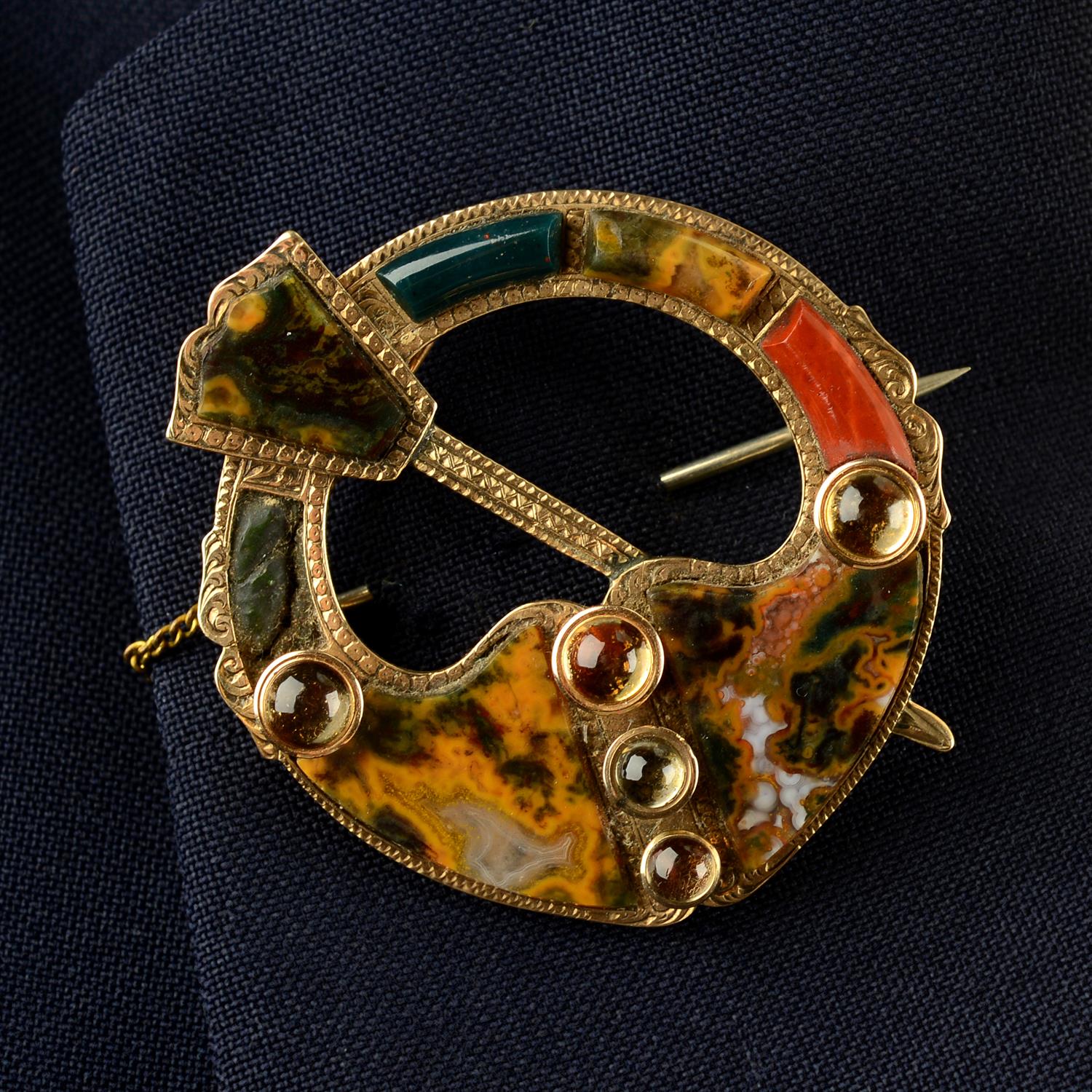 A mid to late Victorian 9ct gold citrine and vari-agate penannular brooch.