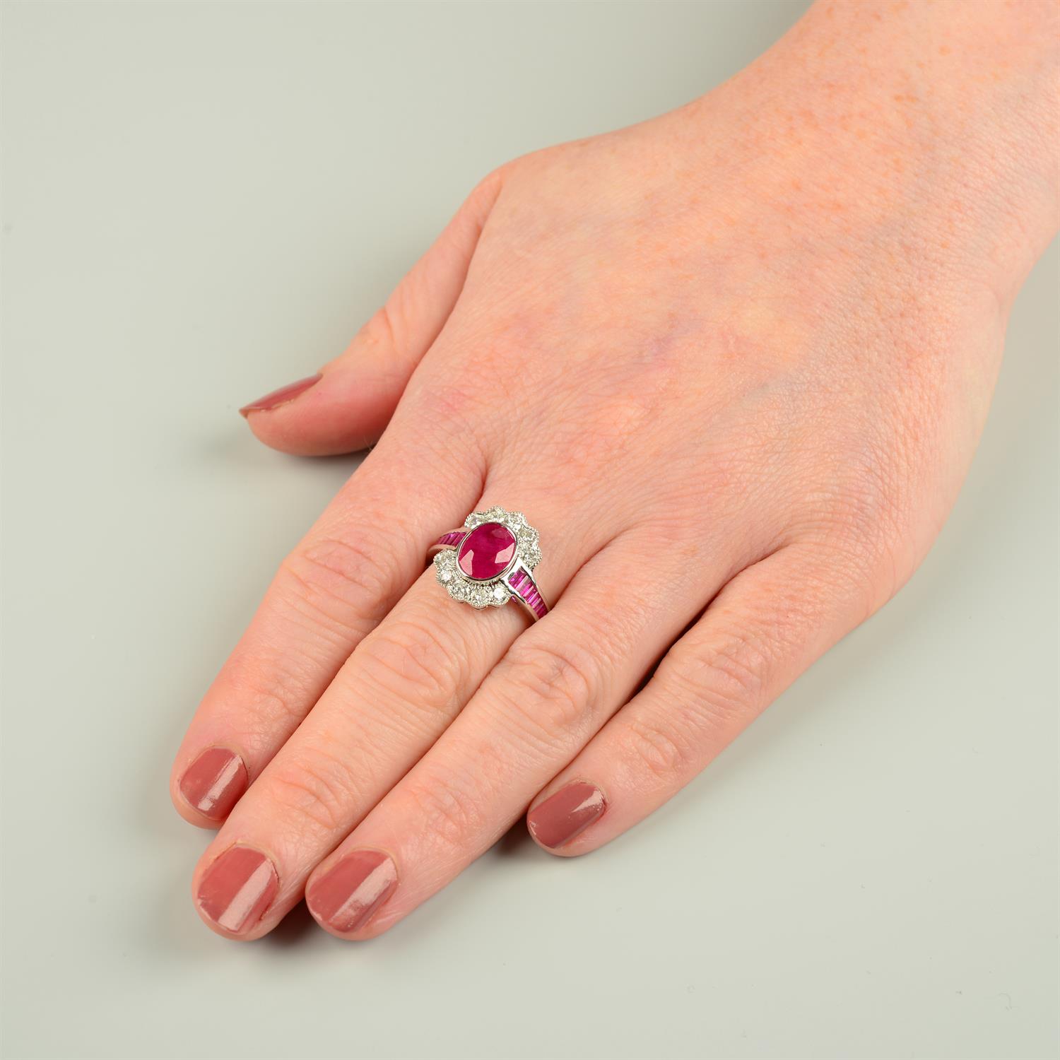 An 18ct gold oval-shape ruby and brilliant-cut diamond cluster ring, with calibre-cut ruby line - Image 5 of 5