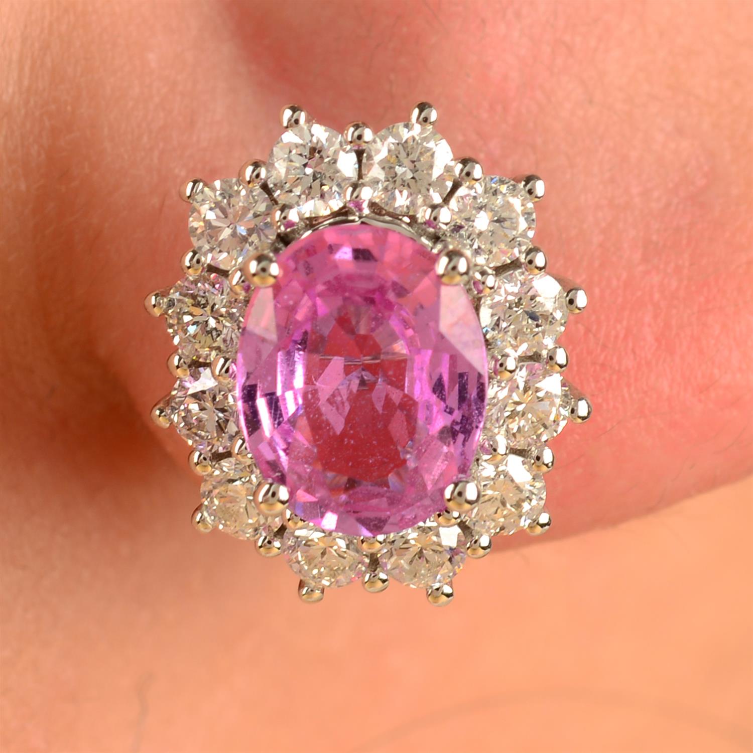 A pair of 18ct gold pink sapphire and brilliant-cut diamond cluster earrings.