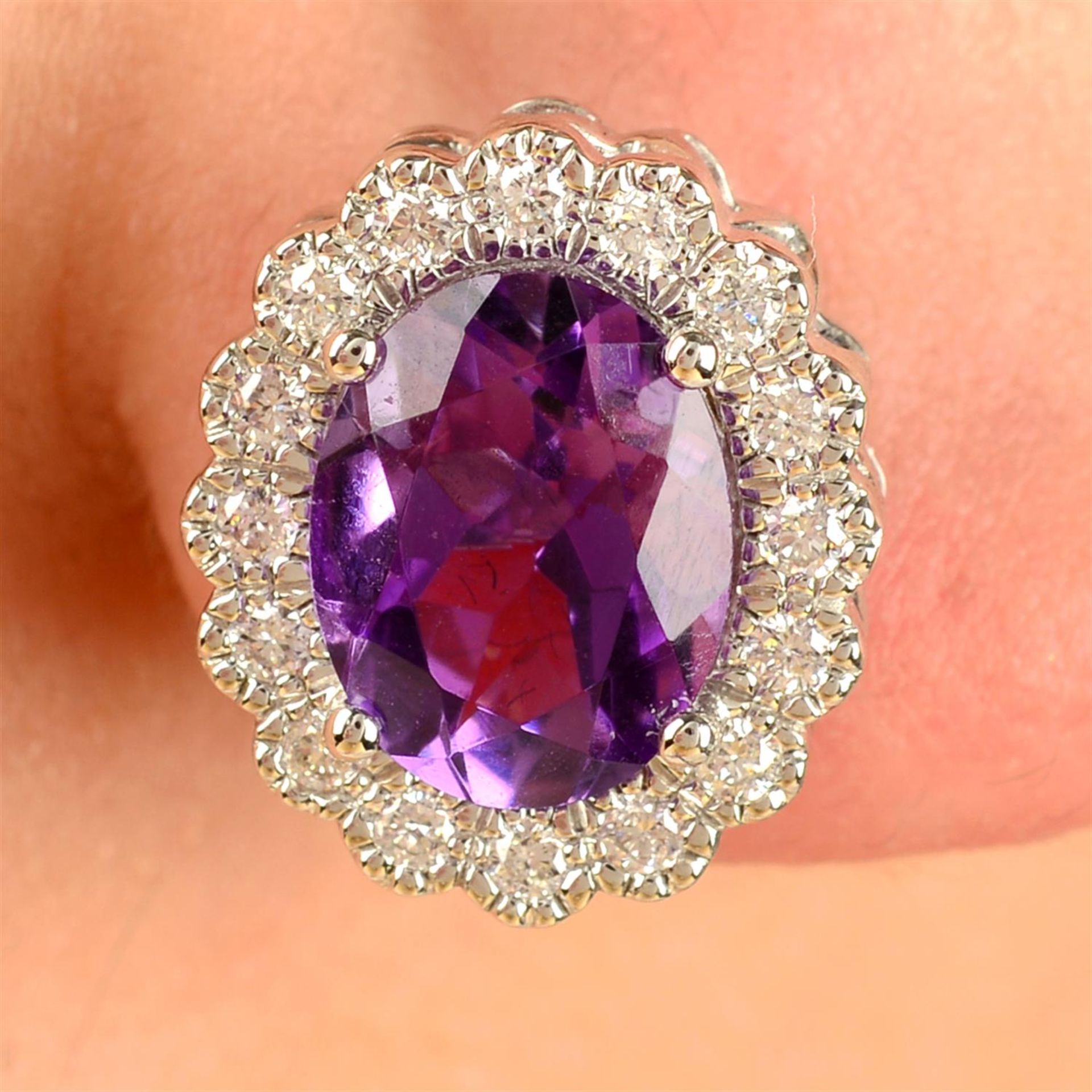 A pair of 18ct gold amethyst and brilliant-cut diamond cluster earrings.