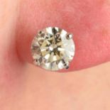 A pair of platinum circular-cut diamond stud earrings.