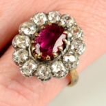 A ruby and old-cut diamond cluster ring.