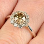 An 18ct gold 'brown' diamond and diamond cluster ring.