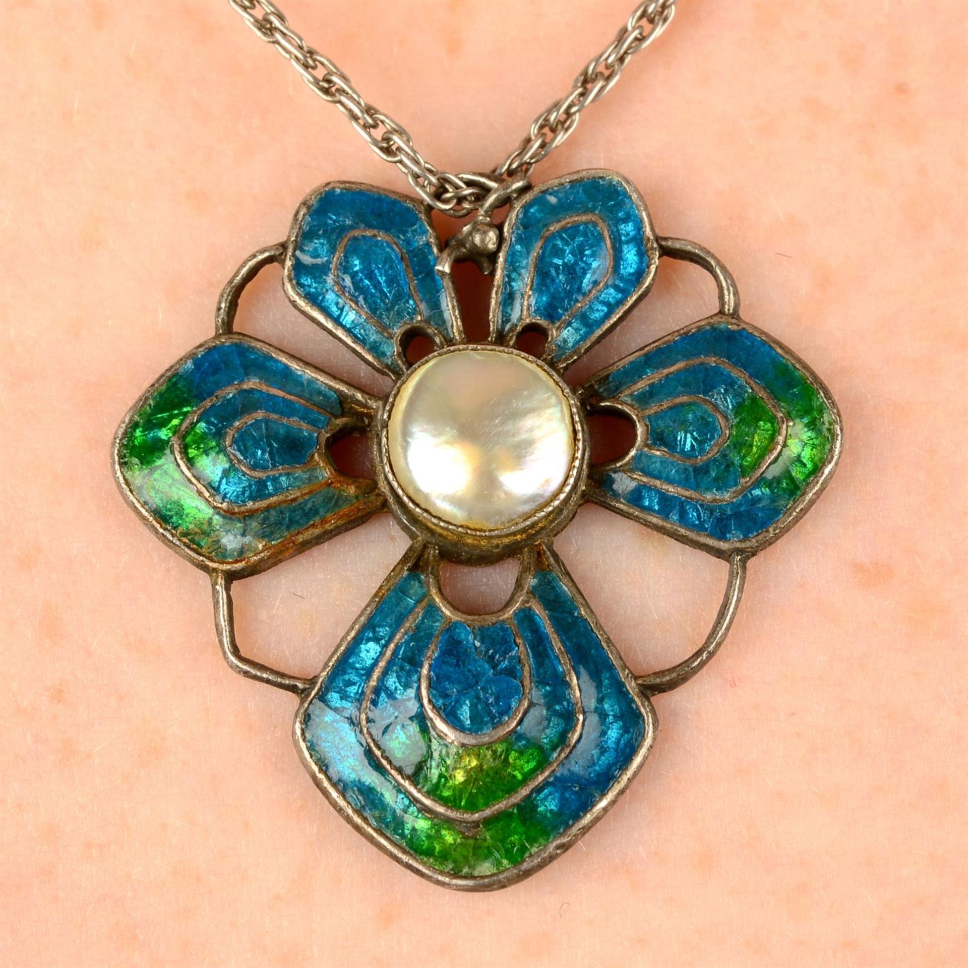 An Arts and Crafts silver blister pearl and enamel floral pendant, by Liberty & Co.