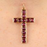 A late 19th century gold pink garnet cross pendant.