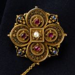 A mid to late 19th century gold cannetille, ruby, sapphire and split pearl accent quatrefoil brooch.