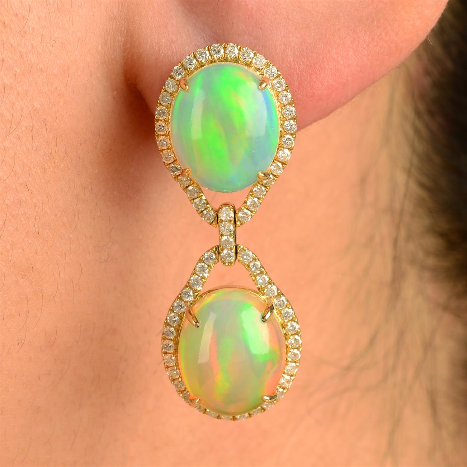 A pair of opal and brilliant-cut diamond drop earrings.