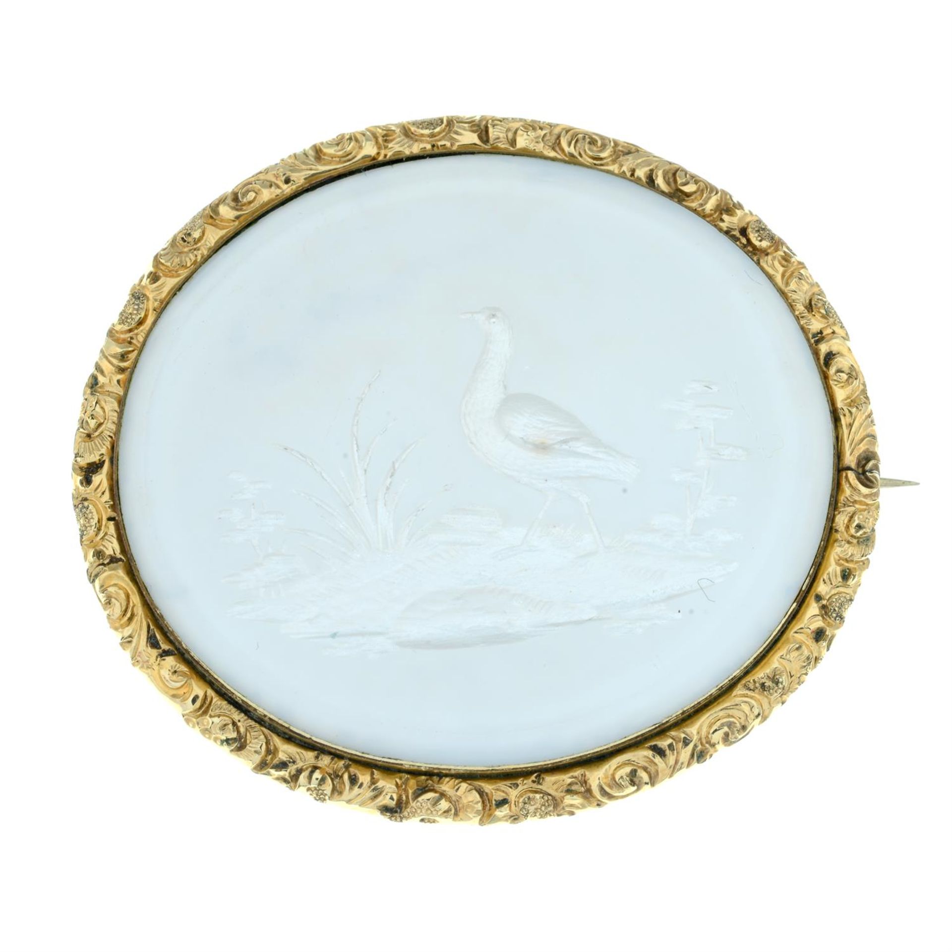 A late 19th century carved mother-of-pearl panel brooch, depicting a bird and flora. - Image 2 of 4