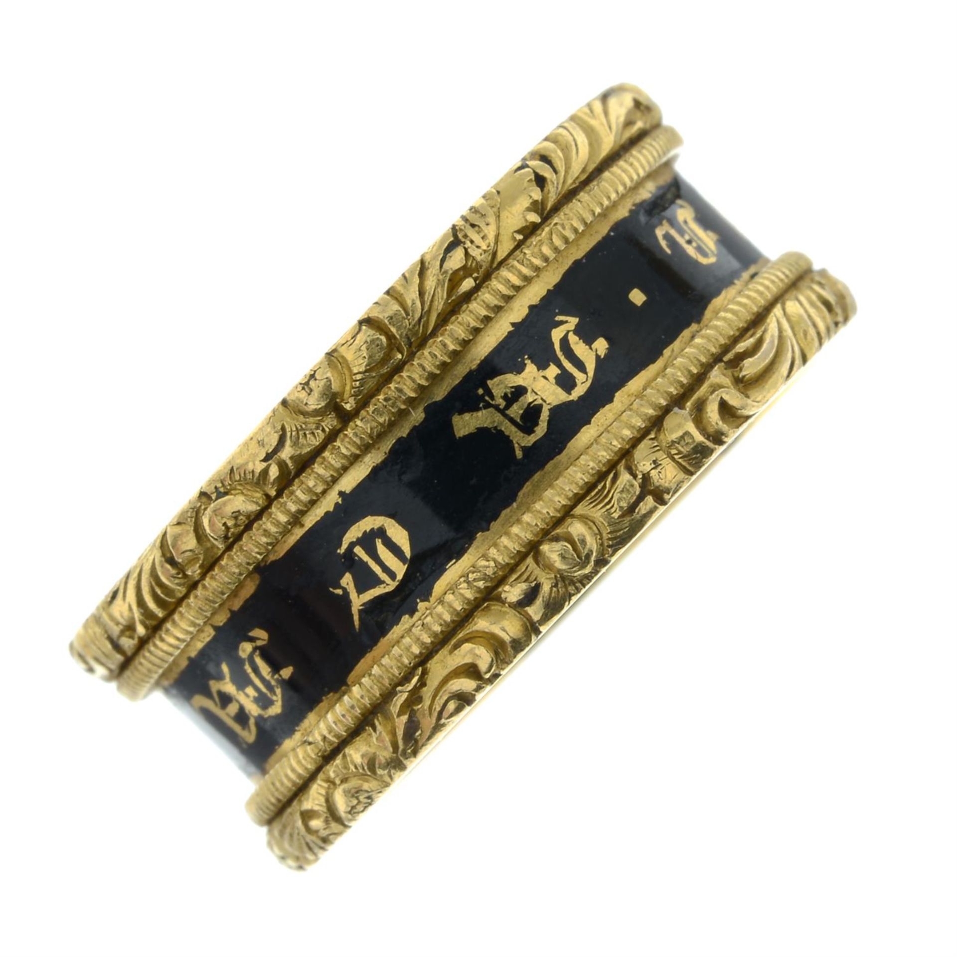 An early Victorian 22ct gold black enamel and gilt 'In Memory Of' band ring, with foliate embossed - Image 2 of 5