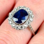 A sapphire and old-cut diamond cluster ring.