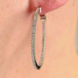 A pair of 18ct gold brilliant-cut diamond hoop earrings.