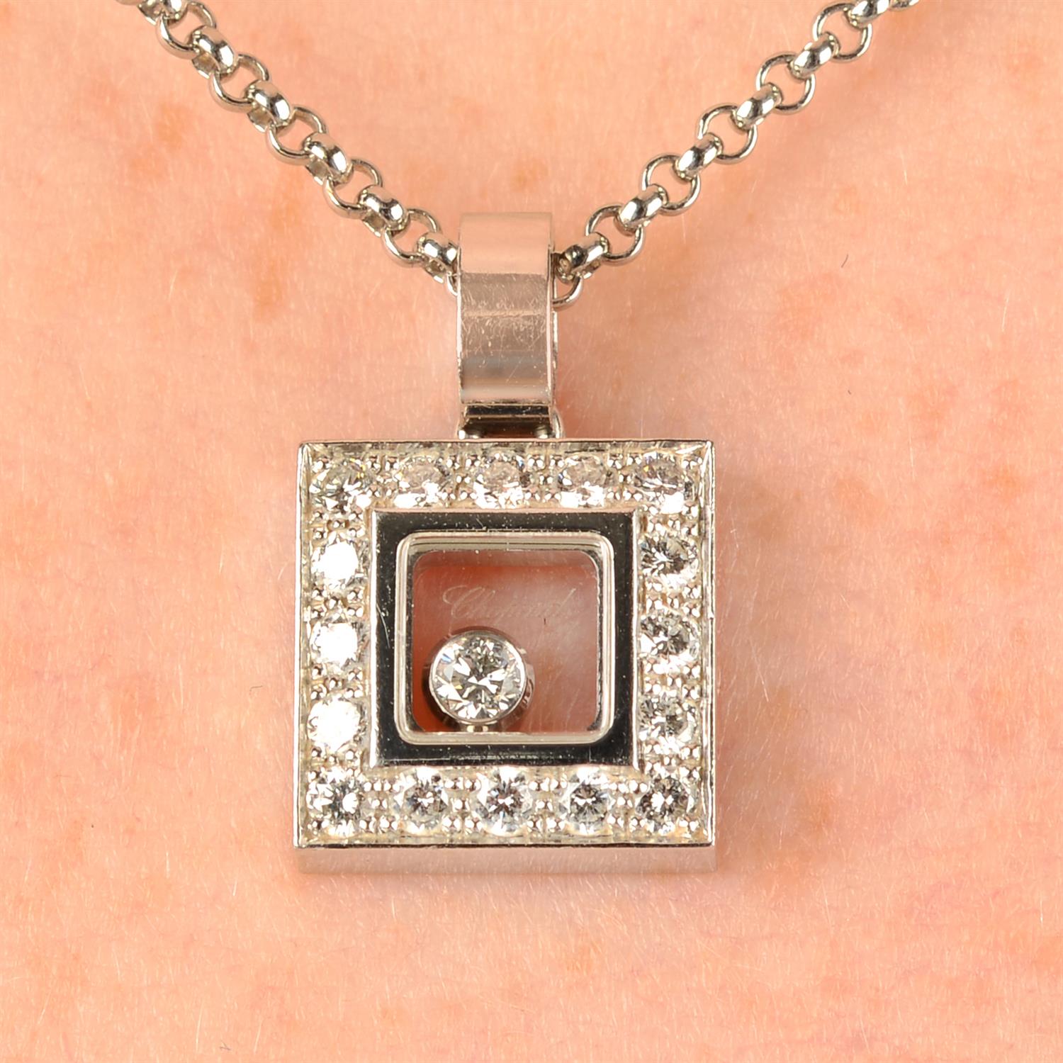 An 18ct gold 'Happy Diamonds' square-shape pendant, with chain, by Chopard.