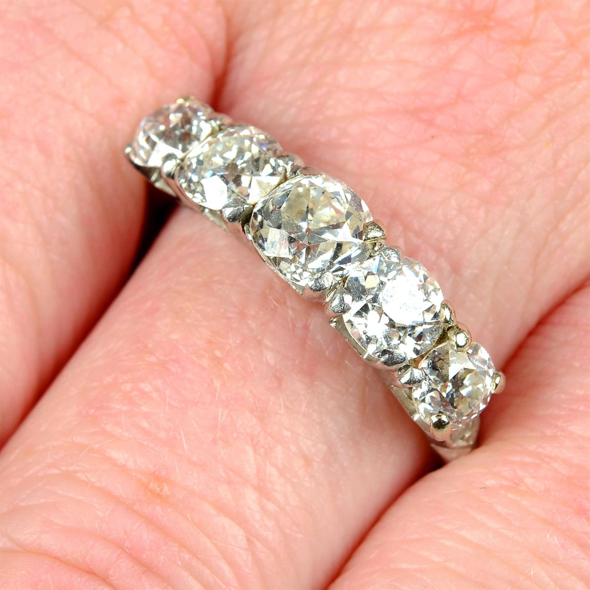 An early 20th century platinum graduated old-cut diamond five-stone ring.