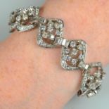 A mid 20th century 9ct gold vari-cut diamond openwork bracelet.