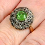An early 20th century platinum and 15ct gold demantoid garnet and rose-cut diamond ring.