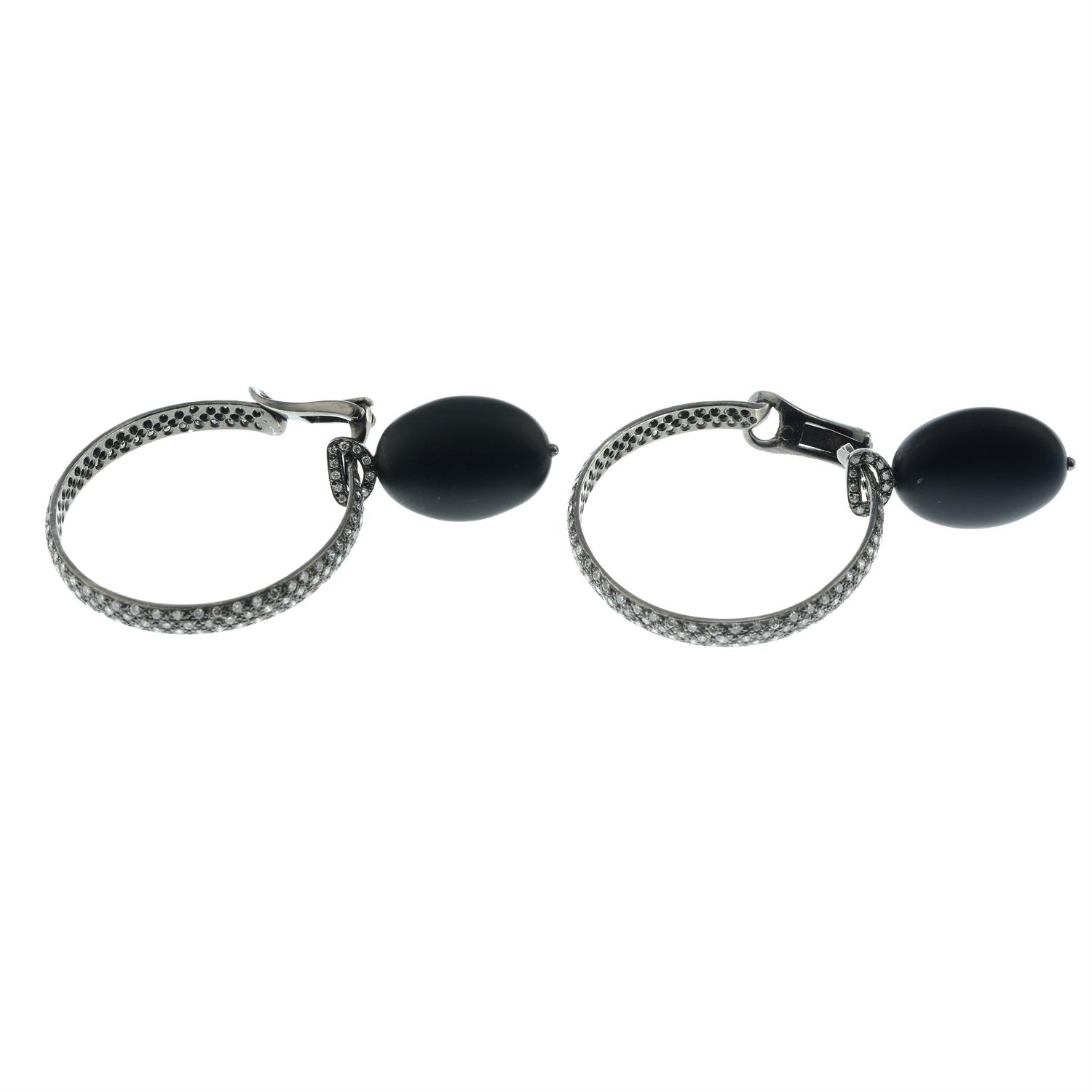 A pair of pavé-set diamond hoop earrings, with detachable black rubber and diamond drop. - Image 3 of 4