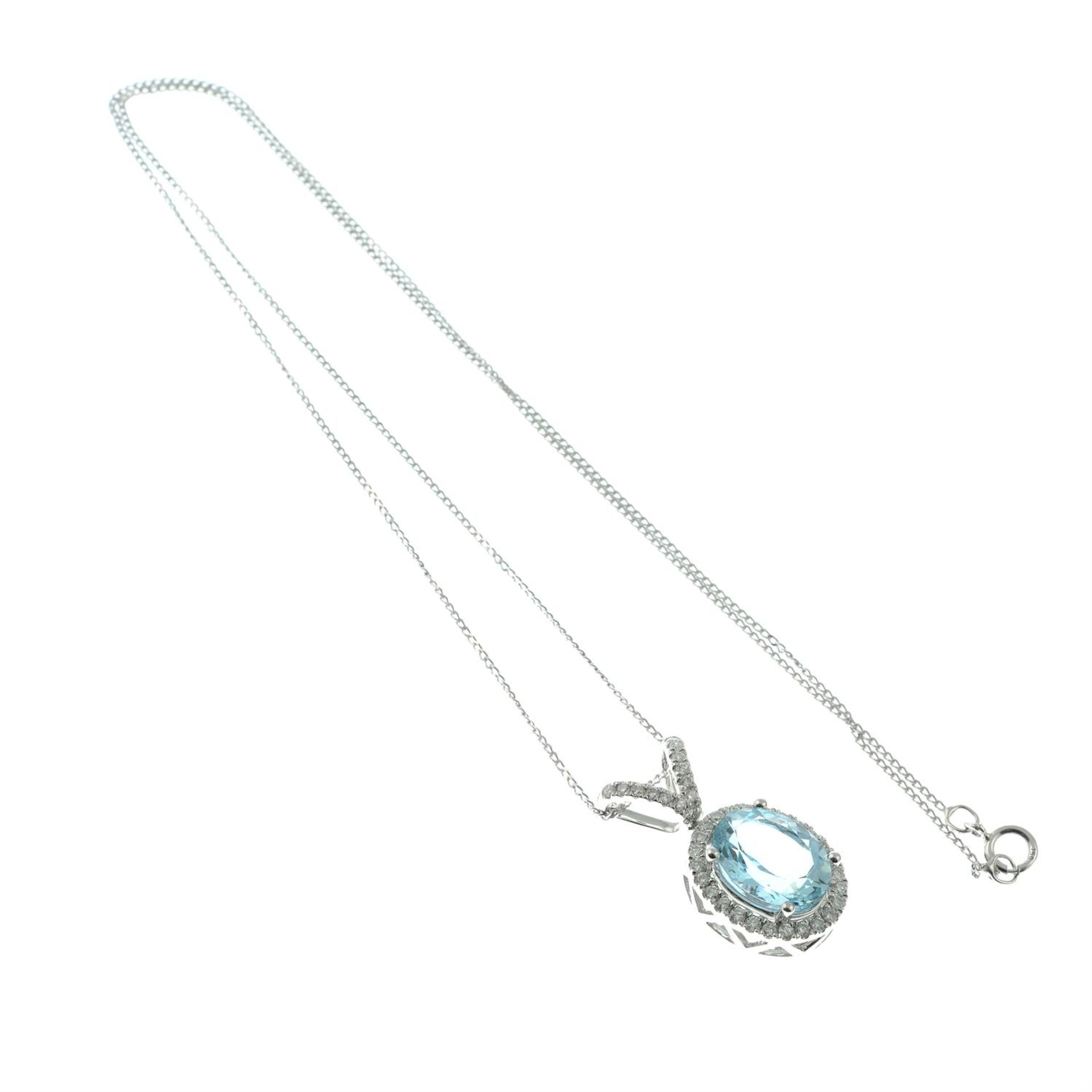 An 18ct gold aquamarine and brilliant-cut diamond pendant, with trace-link chain. - Image 4 of 5