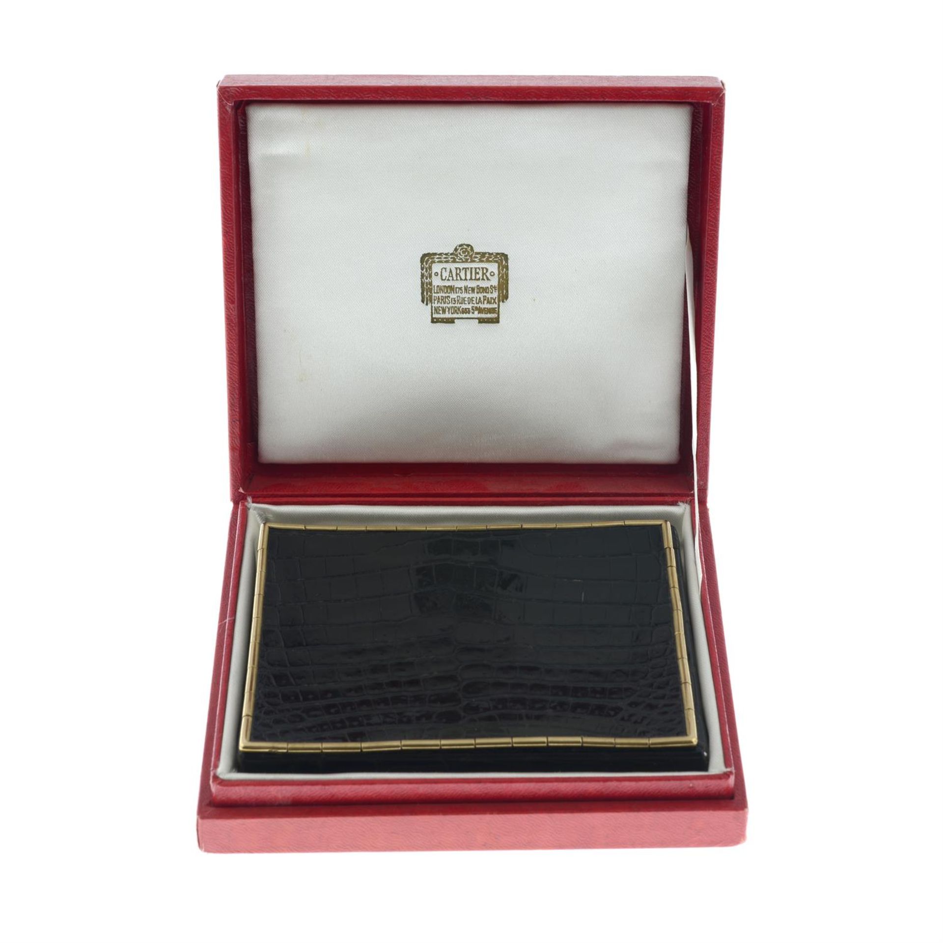 A mid 20th century 9ct gold mounted crocodile skin cigarette case, by Cartier. - Image 5 of 5